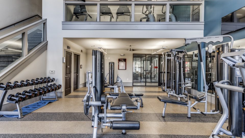 a gym with a large number of equipment at The  Carson @ Twin Creeks