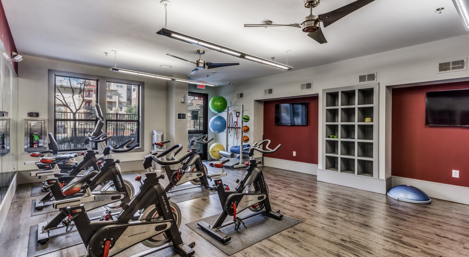 a gym room with exercise bikes and treads at The  Carson @ Twin Creeks