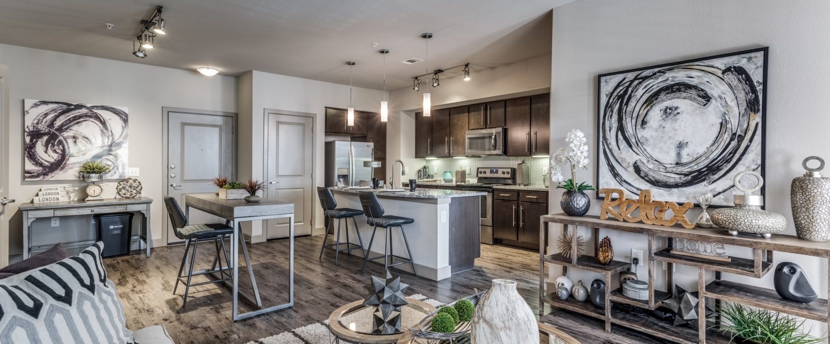 the living room and kitchen area of a home at The  Carson @ Twin Creeks