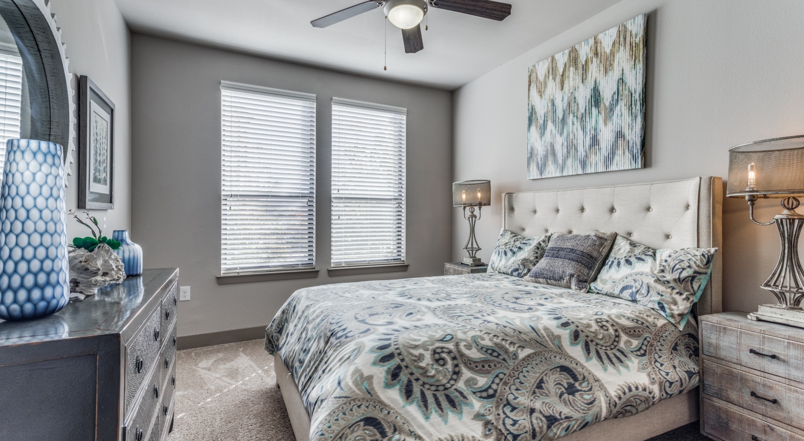 a bedroom with a large bed and ceiling fan at The  Carson @ Twin Creeks