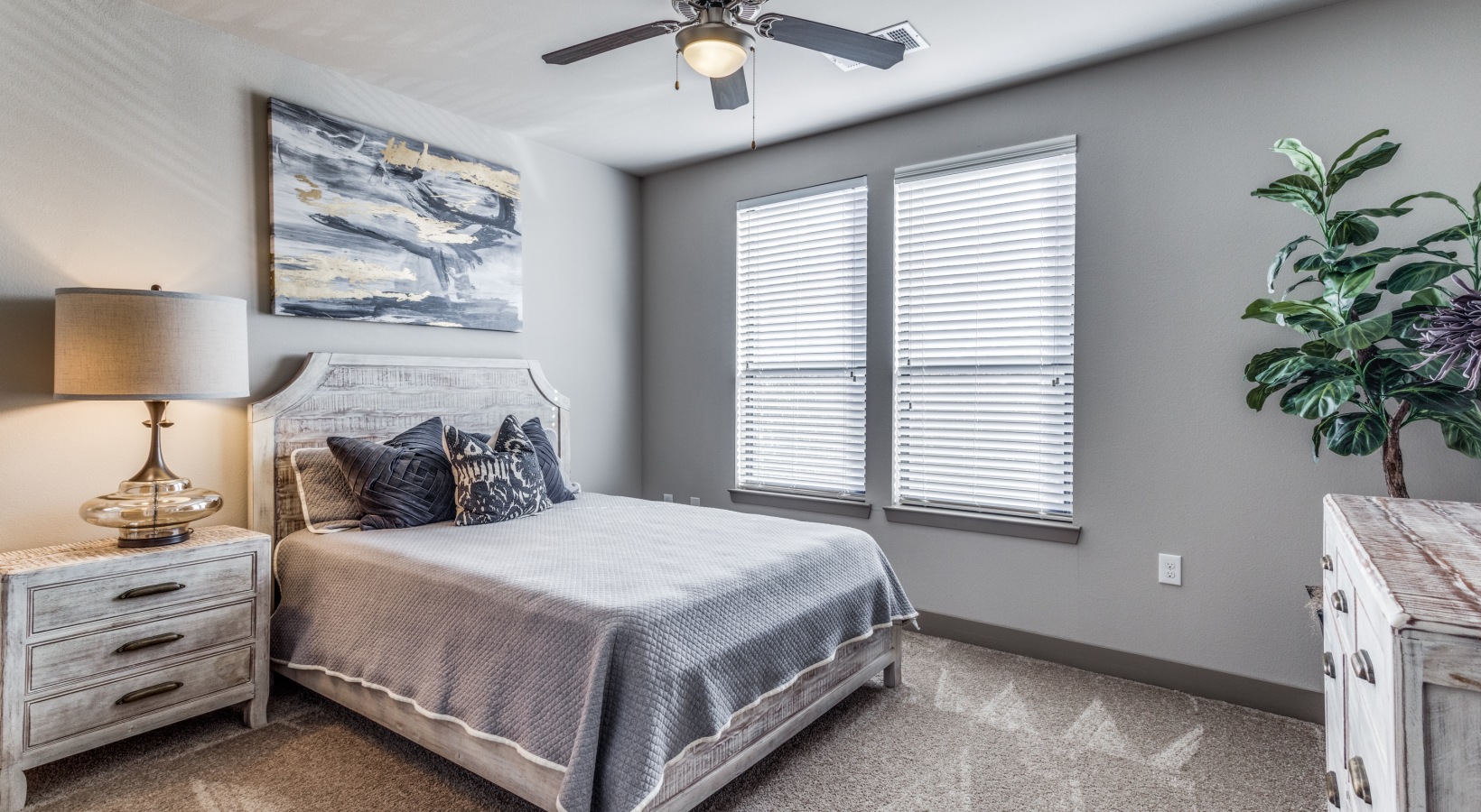 a bedroom with a ceiling fan and a bed at The  Carson @ Twin Creeks